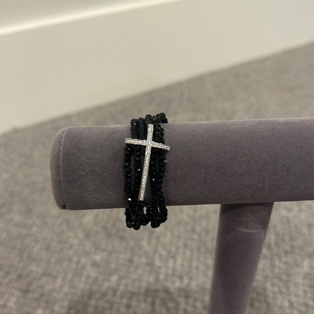 black bracelet with silver cross